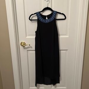 Black flowing a-line dress with beautiful accent neckline